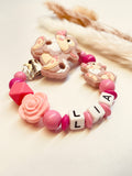 Schnullerkette Hase mit Rose pink rosa personalisiert handgefertigt Babygeschenk Mädchen