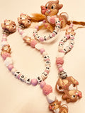 Schnullerkette, Kinderwagenkette und Greifring Hase weiß rosa, personalisiert