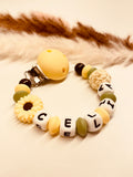 Schnullerkette Sonnenblume gelb grün personalisiert mit Namen Baba Geschenk Geburt