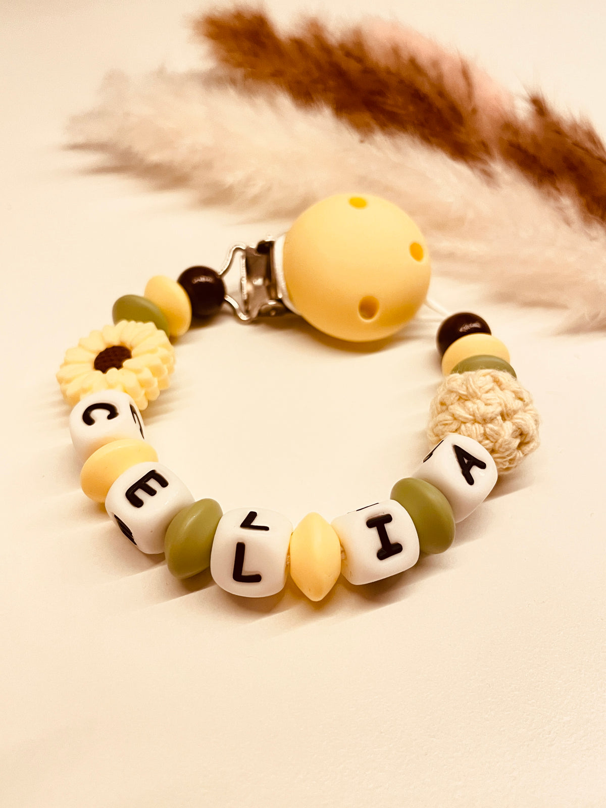 Schnullerkette Blume gelb grün 12,90€, statt 17,90€
