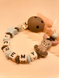Schnullerkette Kinderwagenkette Greifring personalisiert mit Namen Esel blau/grau
