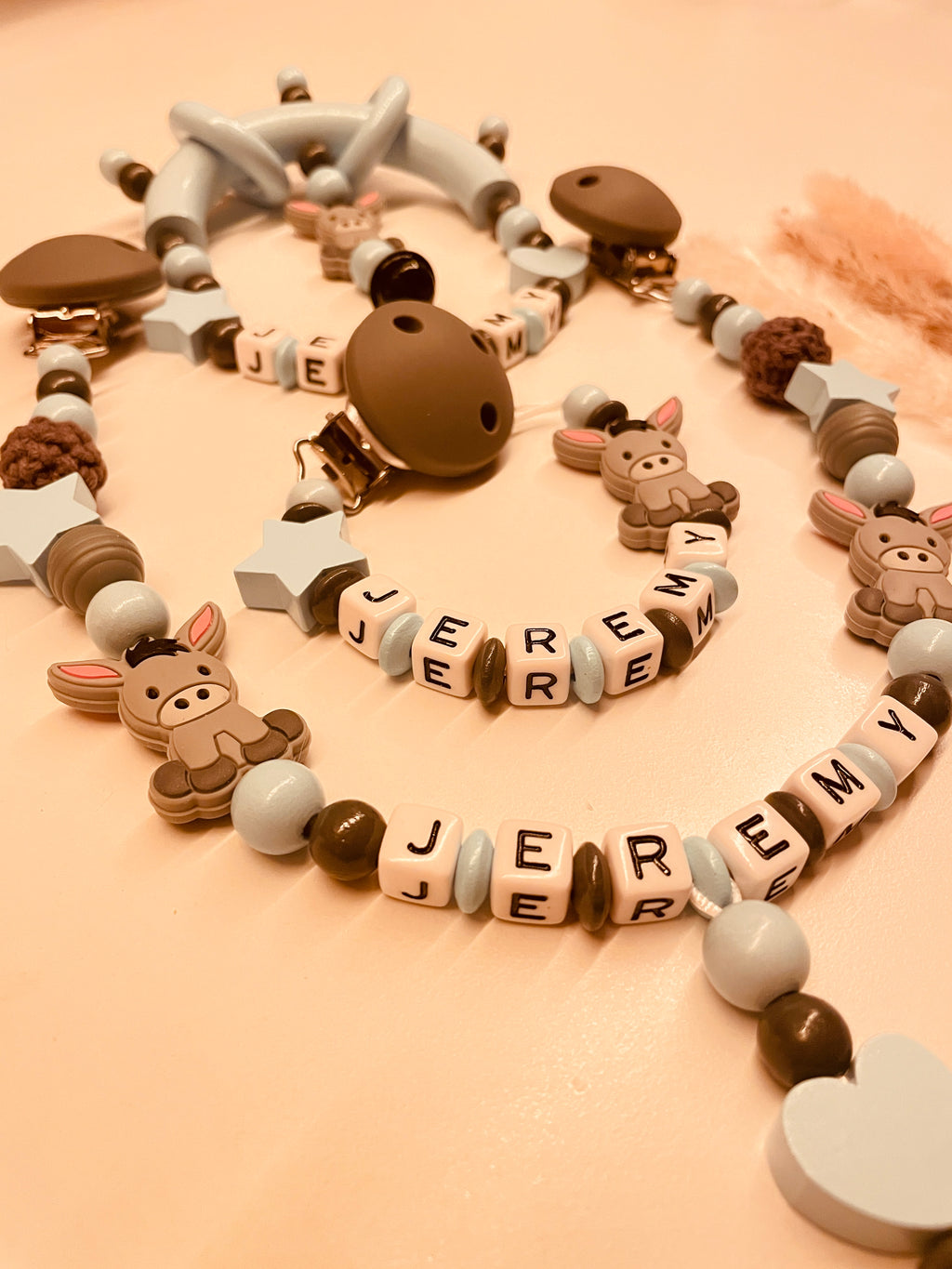 Schnullerkette Kinderwagenkette Greifring personalisiert mit Namen Esel blau/grau