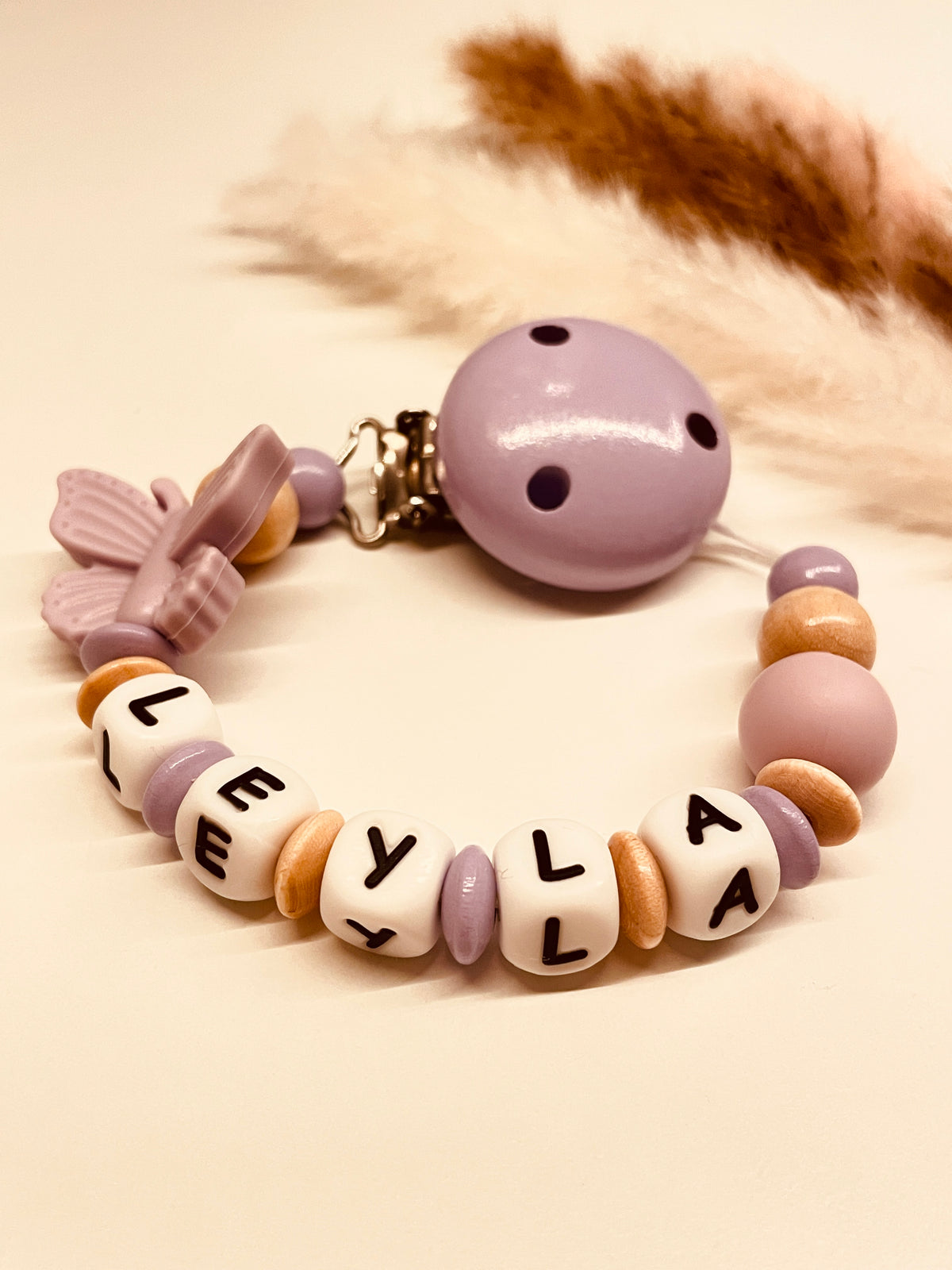 Schnullerkette Schmetterling flieder beige
