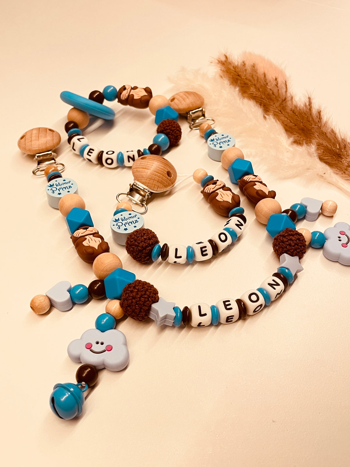 Schnullerkette, Kinderwagenkette Otter  personalisiert blau braun
