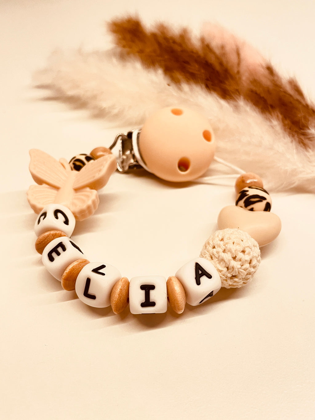Schnullerkette Schmetterling Herz beige natur leo