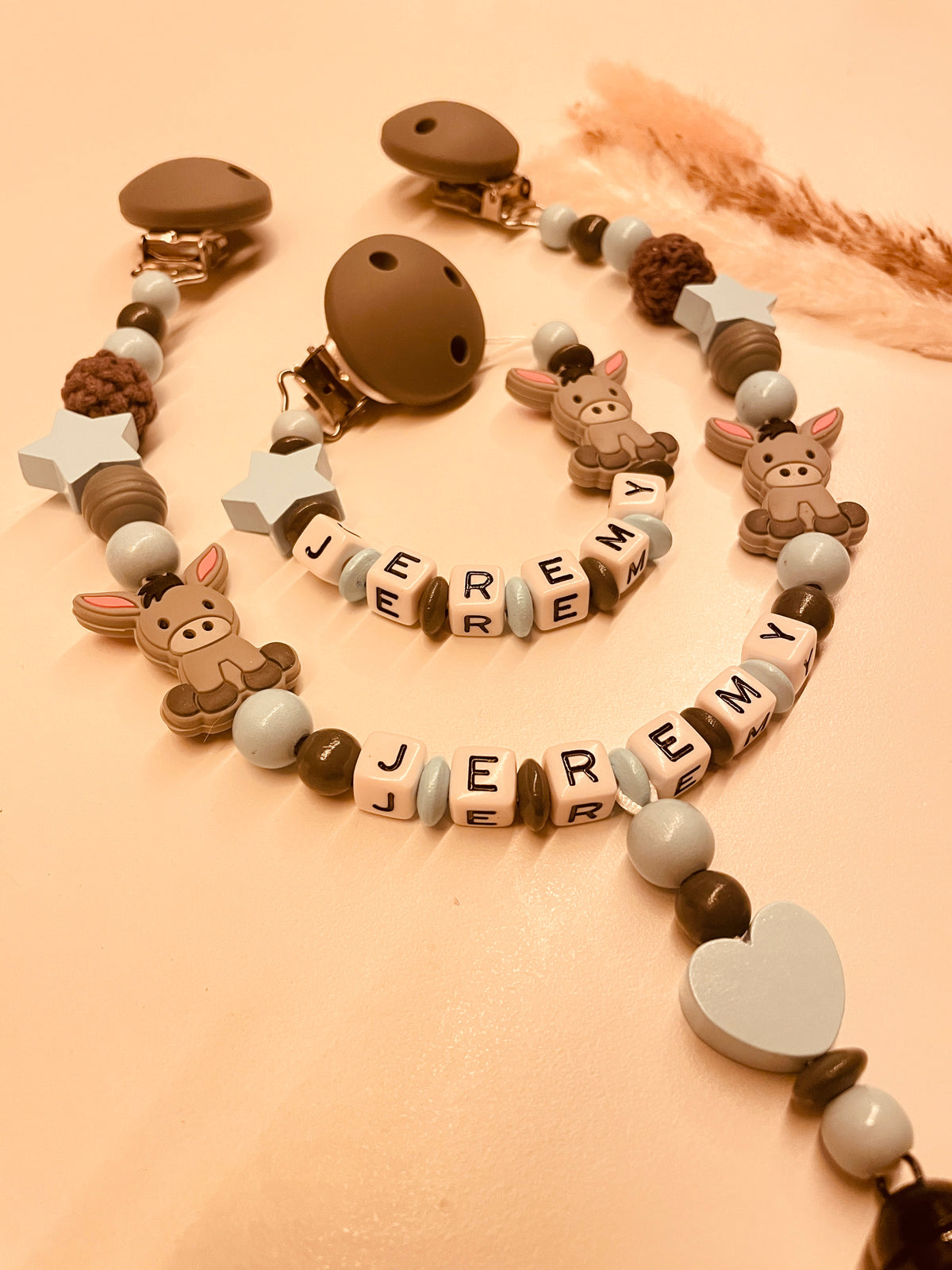 Schnullerkette Kinderwagenkette Greifring personalisiert mit Namen Esel blau/grau