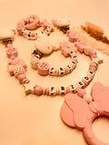 Schnullerkette, Kinderwagenkette und Greifring Maus mit Schleife kleine Prinzessin in rosa-weiß, personalisiert