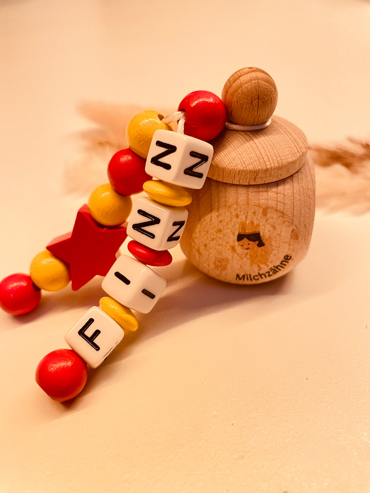 Milchzahndose Stern rot/gelb personalisiert