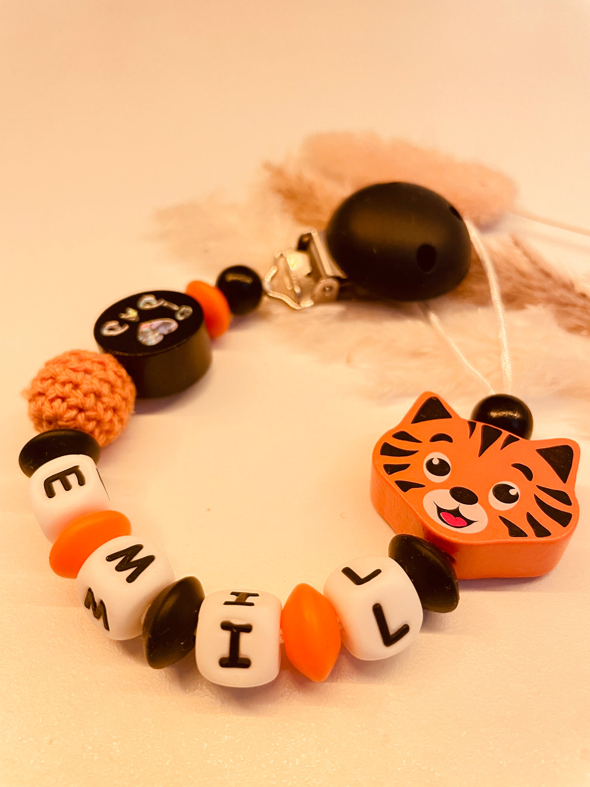 Abverkauf Schnullerkette Tiger schwarz orange