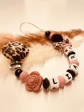 Schnullerkette Leo altrosa schwarz