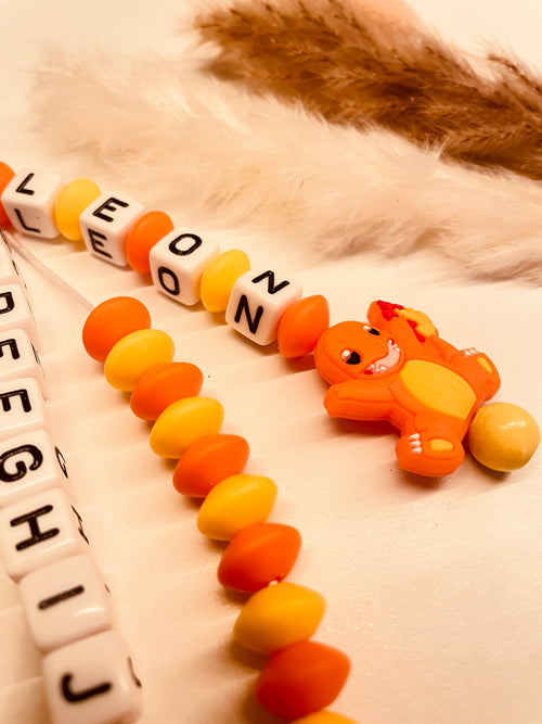 ABC & Rechenkette personalisiert Dinosaurier orange gelb